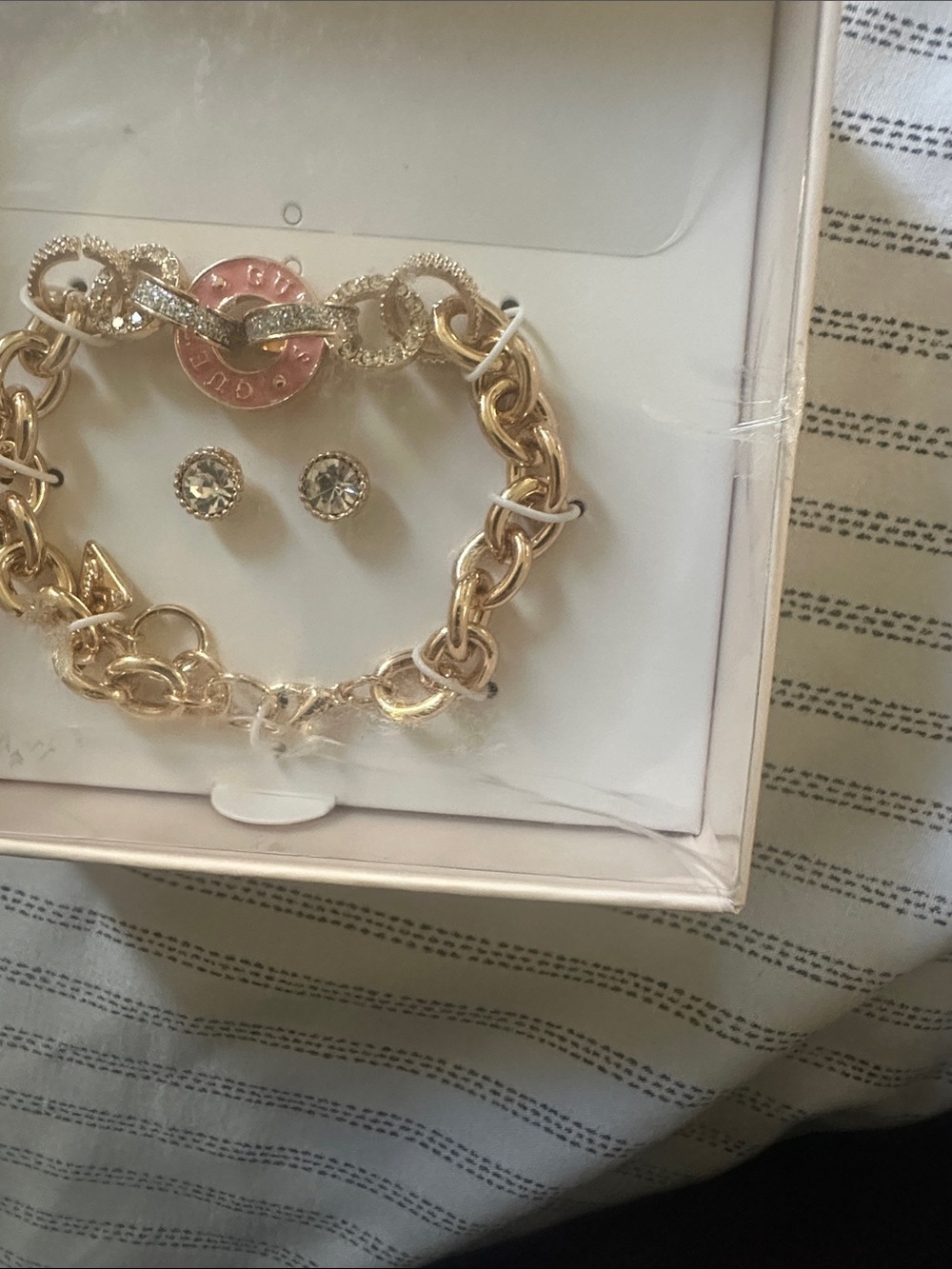 Guess Gold-Tone Chain Bracelet with Pink Logo Charm and Crystal Studs